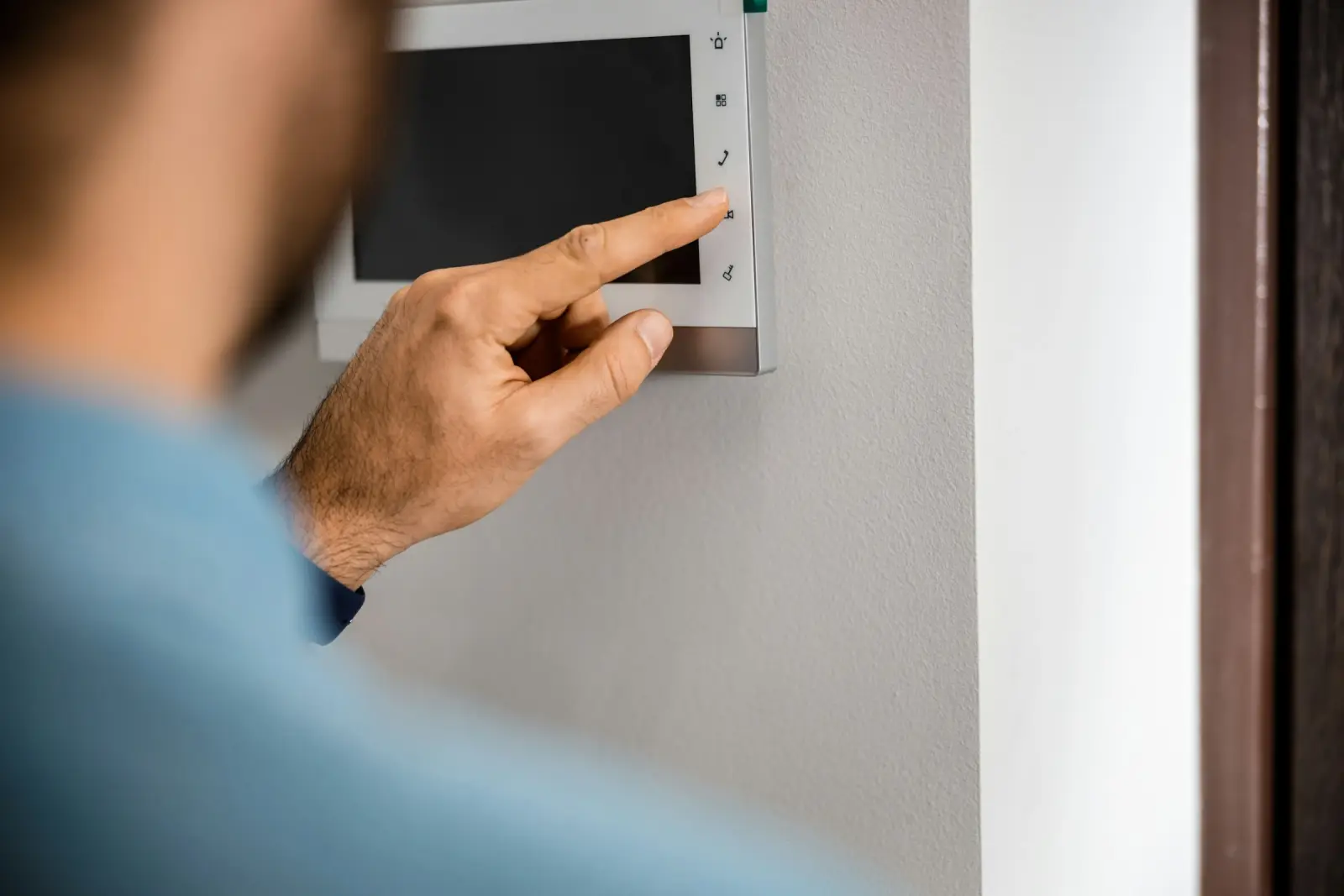 Person operating an alarm control panel